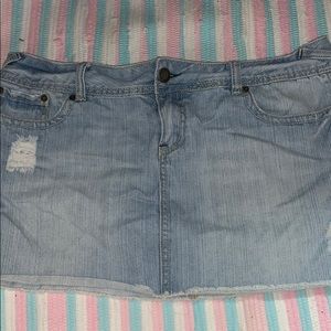 Distressed denim mini skirt